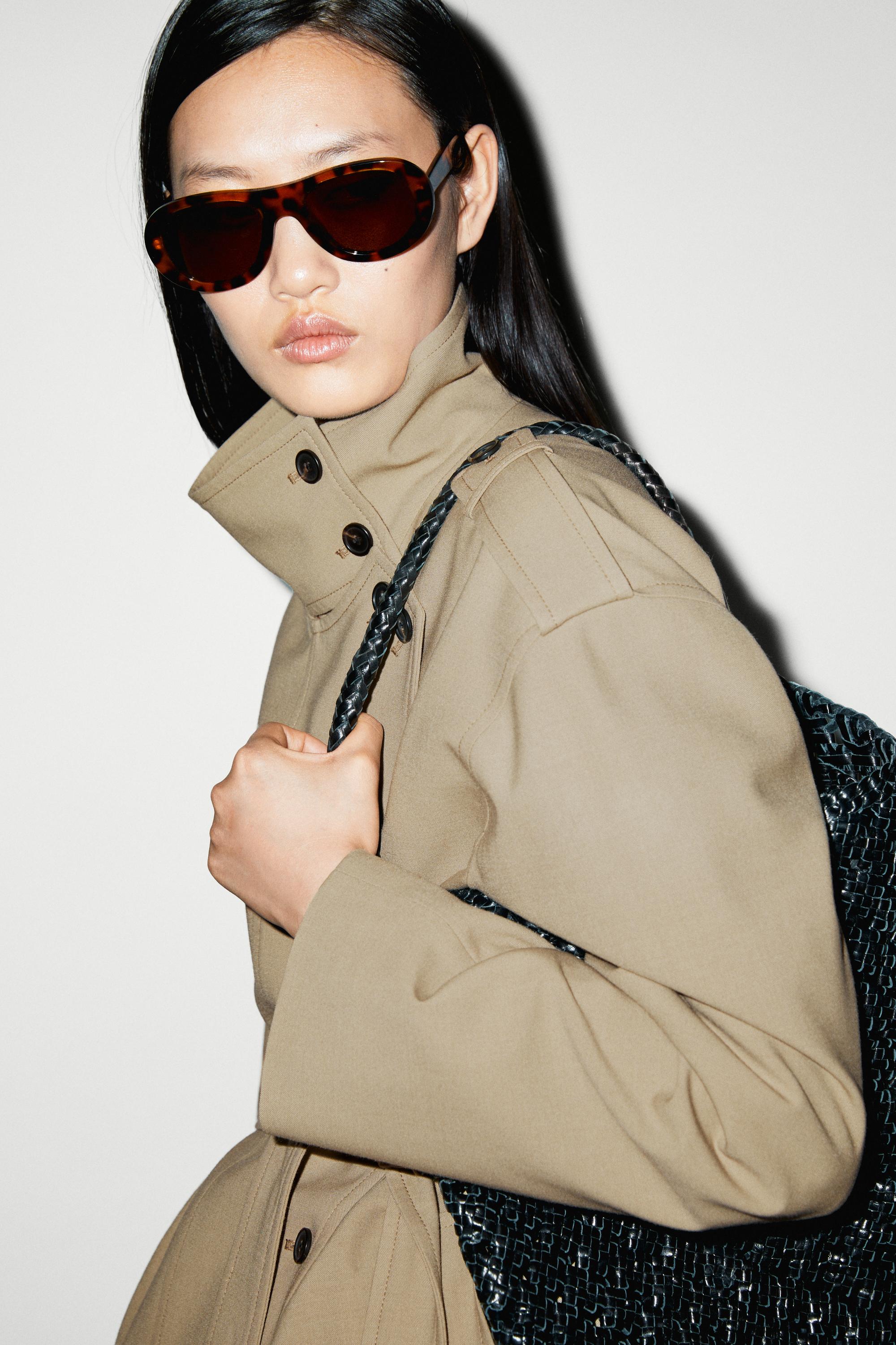 Mid-length belted trench coat